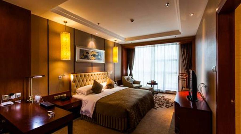 فندق جينغهونغفي  شوانج بانا سنشري جنيوان هوتل المظهر الخارجي الصورة